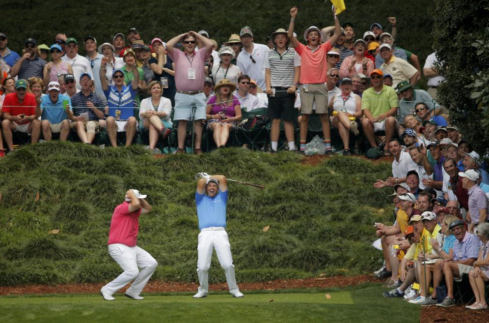 Padraig Harrington of Ireland reacts after missing a hole-in-one on the 9th tee with fellow countryman Shane Lowry (L) during the par 3 event held ahead of the 2015 Masters at Augusta National Golf Course in Augusta, Georgia April 8, 2015. REUTERS/Brian Snyder