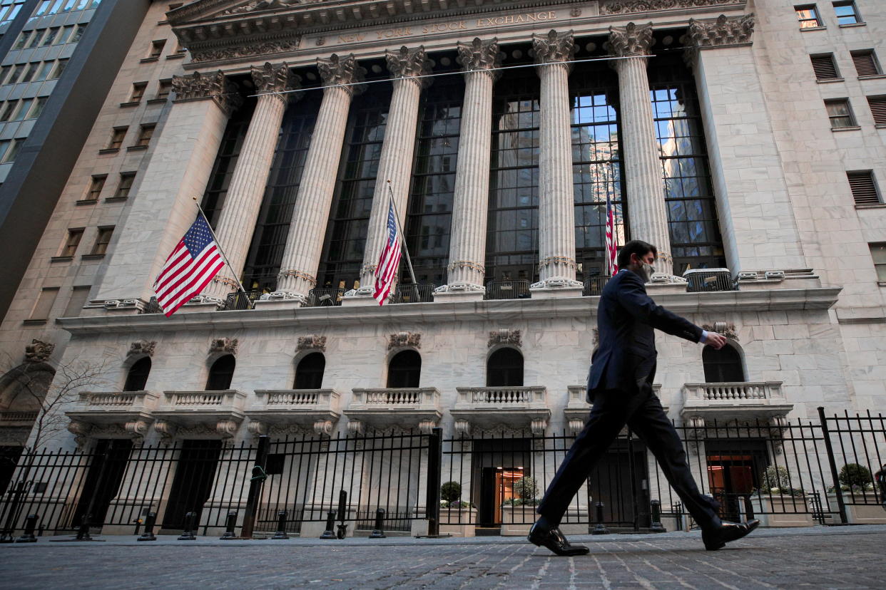 A man walks outside the New York Stock Exchange (NYSE) in New York, U.S., November 24, 2020. REUTERS/Brendan McDermid