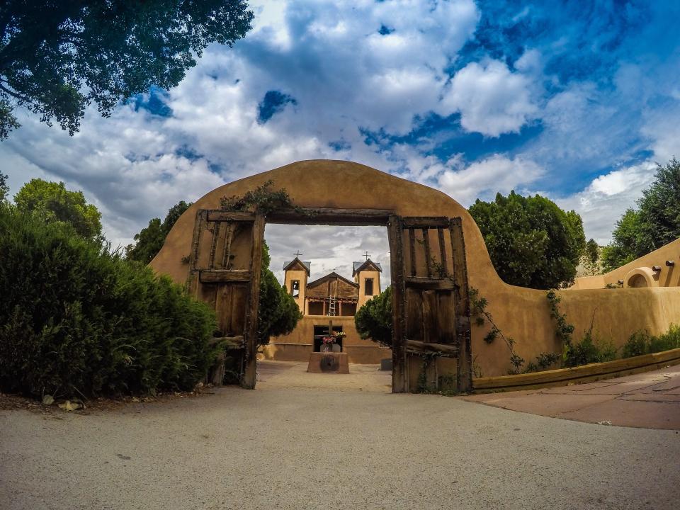 brown stone buildings outside in CHIMAYO NEW MEXICO