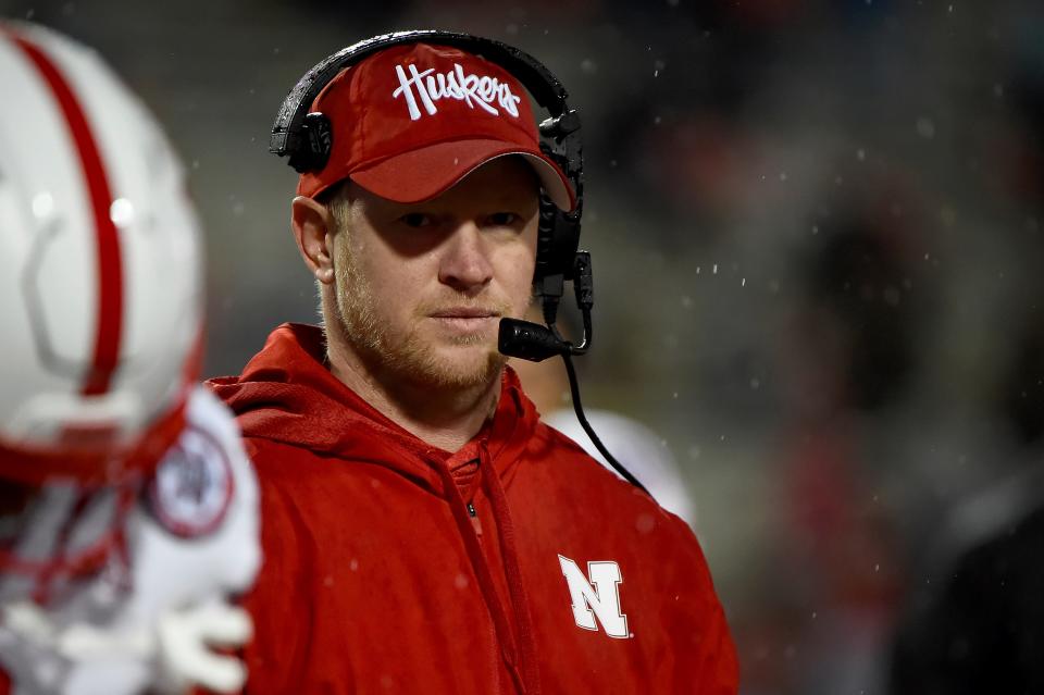 FILE - In this Nov. 23, 2019, file photo, Nebraska head coach Scott Frost looks on during the second half of an NCAA college football game against Maryland in College Park, Md.  The Big Ten will start playing football at what normally would be midseason. The coronavirus pandemic limited or eliminated most spring practices. Positive COVID-19 tests and precautions, along with uncertainty about whether there would even be a season, caused disruptions in summer workouts and preseason practices. (AP Photo/Will Newton, File)