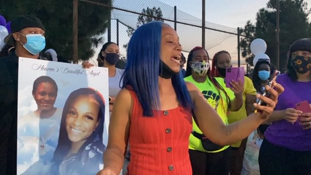 Mikeona Johnson’s family is pictured at a vigil in Los Angeles in September 2020.