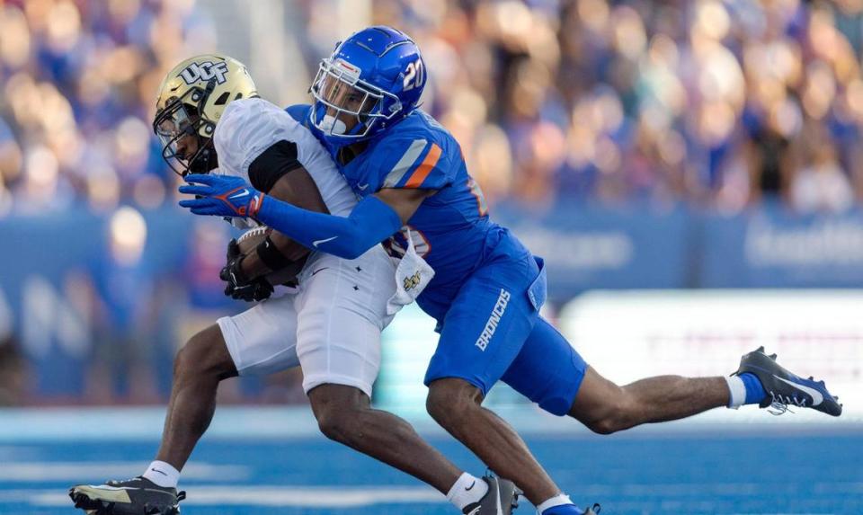 Boise State safety Ty Benefield tackles UCF wide receiver Xavier Townsend in the second half, Saturday, Sept. 9, 2023.