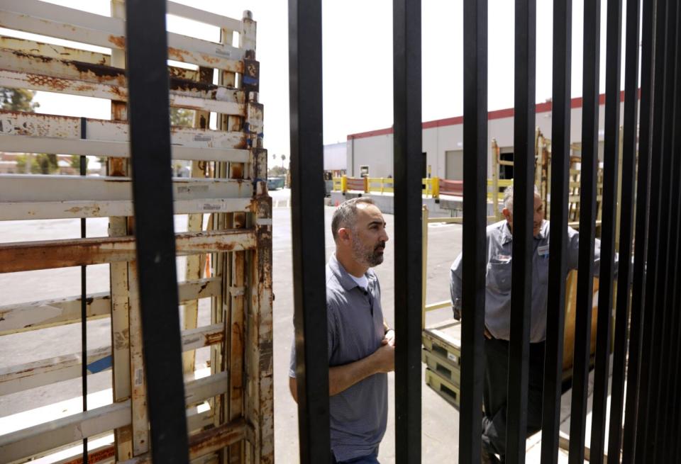 Mike Balderrama and Frank Carracci of Cardinal Glass Industries, in Watts.