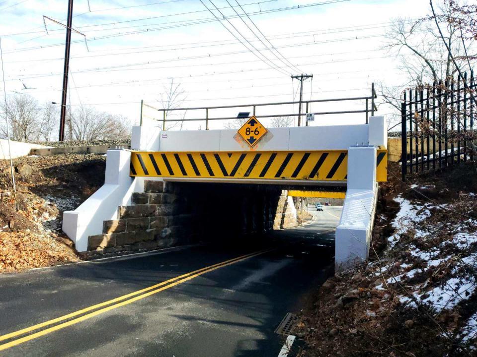 The railroad bridge on Parsonage Road in Edison where a new yellow beam alerting drivers of the bridge height was recently installed.