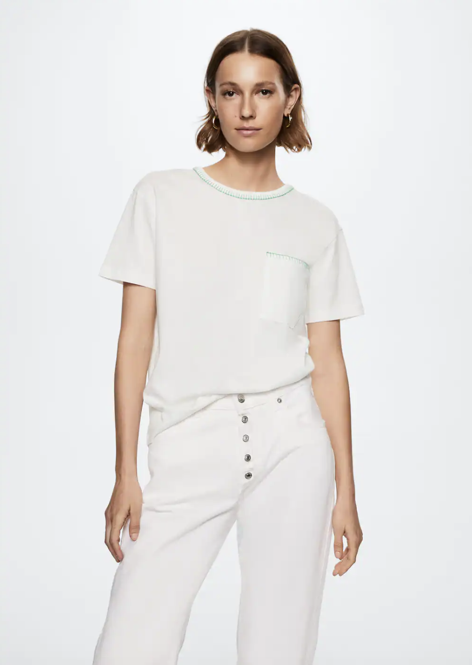 model wearing white jeans and white Embroidered Cotton Shirt (photo via Mango)