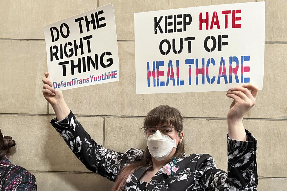 Elliott Braatz, 17, protests a bill that would ban gender-affirming care for anyone 18 and younger in the state, in the Capitol rotunda on Thursday, March 23, 2023, in Lincoln, Neb. The contentious bill advanced Thursday, despite a threat by several lawmakers to filibuster the rest of the session if it moved forward. (AP Photo/Margery Beck)