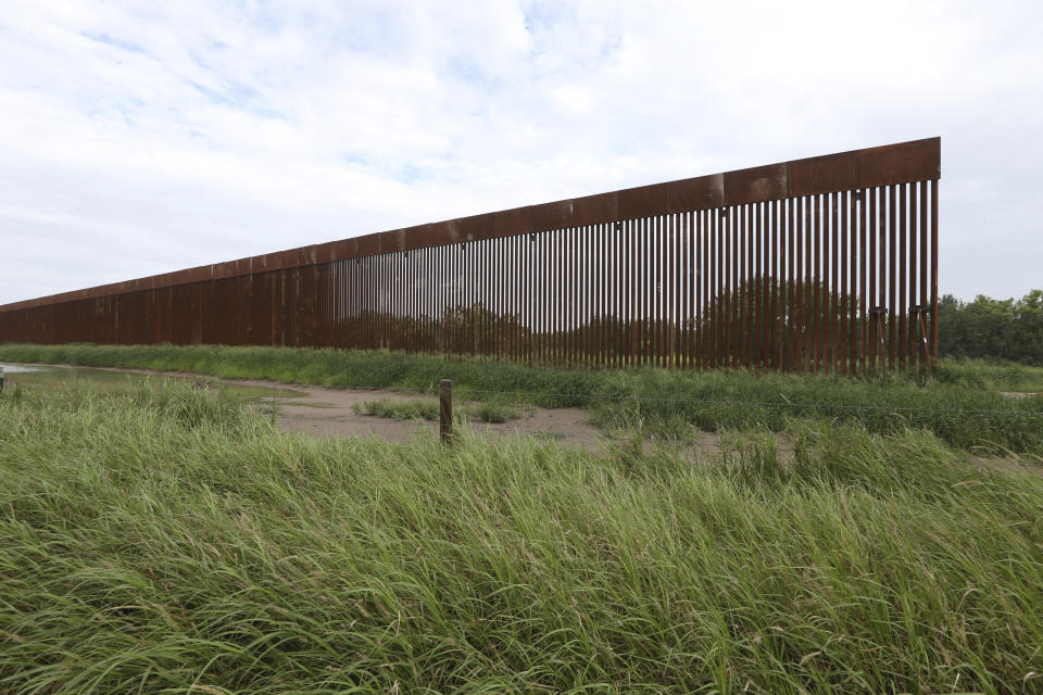 FILE - A border wall section stands on July 14, 2021, near La Grulla, Texas, in Starr County. On Wednesday, Oct. 4, 2023, the Biden administration announced that they waived 26 federal laws in South Texas to allow border wall construction, marking the administration's first use of a sweeping executive power employed often during the Trump presidency. The Department of Homeland Security posted the announcement with few details outlining the construction in Starr County, Texas. (Delcia Lopez/The Monitor via AP, File)