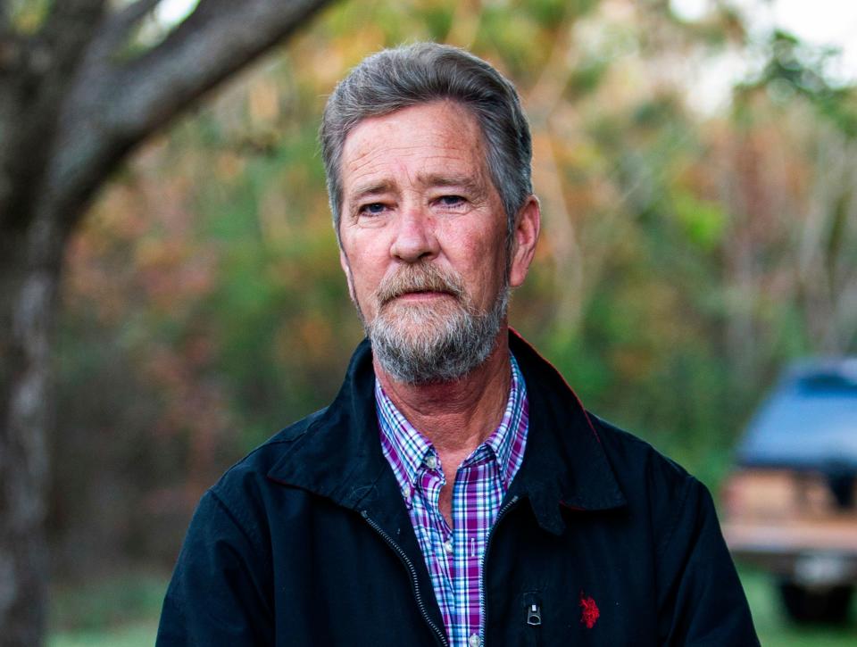 In this Dec. 5, 2018 file photo, Leslie McCrae Dowless Jr. poses for a portrait outside of his home in Bladenboro, N.C.