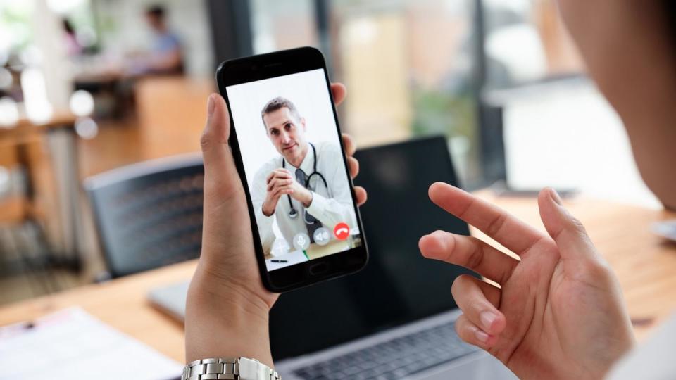 PHOTO: Businesswoman talking with doctor online from office. (STOCK IMAGE/Getty Images)