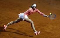 Maria Sharapova of Russia returns the ball to Victoria Azarenka of Belarus during their women's quarter-final match at the Rome Open tennis tournament in Rome, Italy, May 15, 2015. REUTERS/Stefano Rellandini