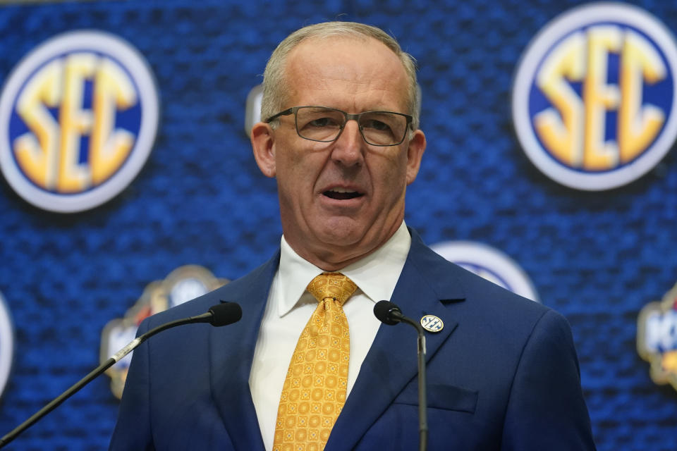 FILE - Southeastern Conference Commissioner Greg Sankey speaks during SEC Media Days, July 18, 2022, in Atlanta. The third in-person meeting of conference commissioners who manage the College Football Playoff since an August directive from their bosses to expand the postseason format ended without a resolution but not without optimism. “There's a will to try and that will is still there,” Sankey said Thursday, Oct. 20, 2022. (AP Photo/John Bazemore, File)