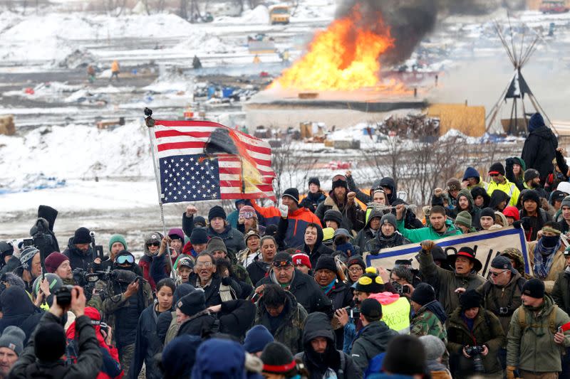 FILE PHOTO: Opponents of the Dakota Access oil pipeline march out of their main camp near Cannon Ball