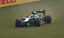 Caterham Formula One driver Giedo van der Garde of Netherlands runs off the track with a damaged car during the Indian F1 Grand Prix at the Buddh International Circuit in Greater Noida, on the outskirts of New Delhi, October 27, 2013. REUTERS/Ahmad Masood (INDIA - Tags: SPORT MOTORSPORT F1)