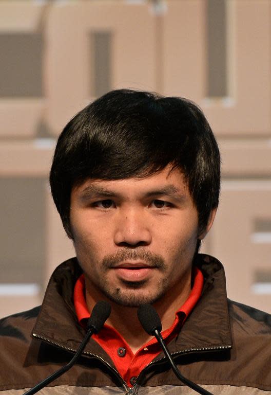 Philippine boxing icon Manny Pacquiao speaks during a pre-fight press conference in Macau, August 25, 2014