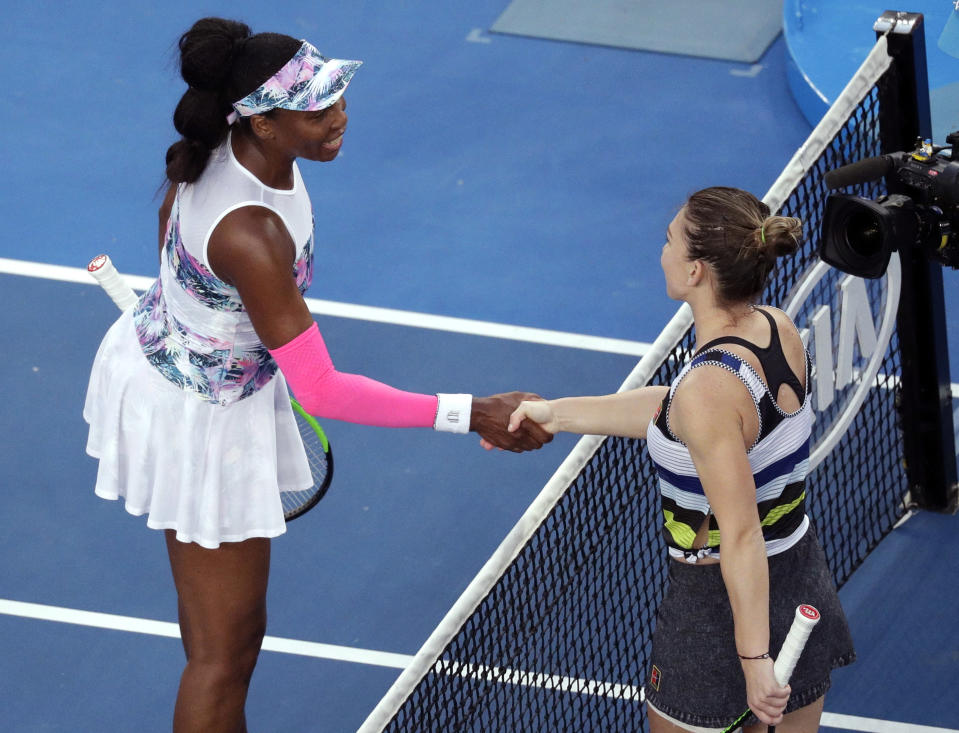 Romania's Simona Halep, right, is congratulated by United States' Venus Williams after winning their third round match at the Australian Open tennis championships in Melbourne, Australia, Saturday, Jan. 19, 2019. (AP Photo/Kin Cheung)