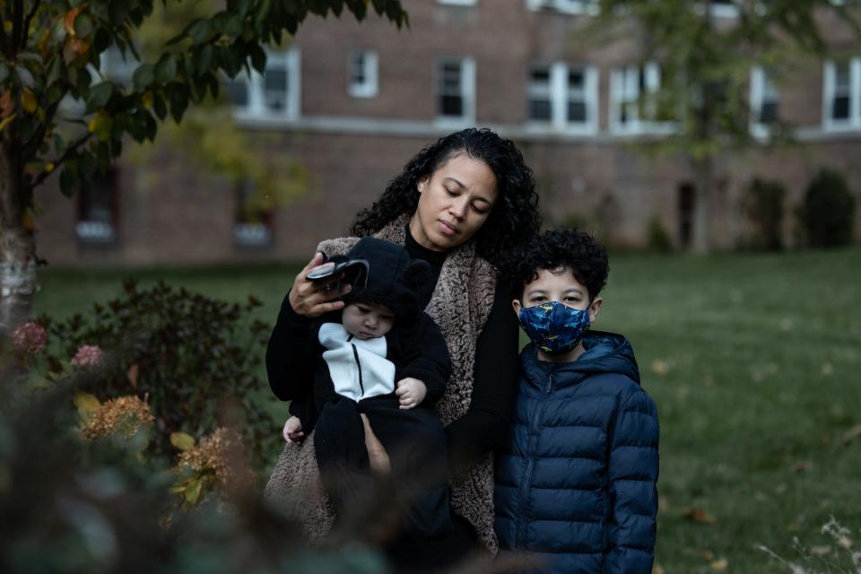 Viviana Echavarria, 38, her 6-month old baby, and her son Achilles Fernandez, 11, pose for a portrait outside their home in the North Riverdale section of the Bronx on Wednesday, Nov. 17. Viviana and her husband were among the parents of New York City school students who didn't feel it was safe for their children to return to in-person learning during the ongoing public health crisis. Viviana says they plan to send her children back to school now that Achilles has had his first COVID-19 shot.