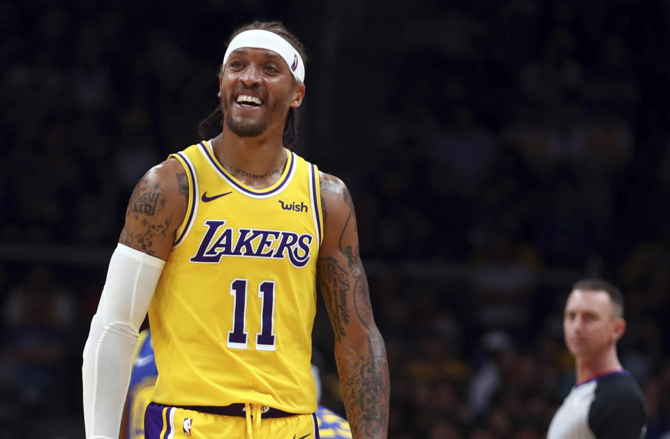 Michael Beasley wasn’t back in uniform on Sunday, but he spent a few minutes on the Lakers’ bench while attending the Lakers-Wizards game with his ailing mother. (AP Photo/Ben Margot)