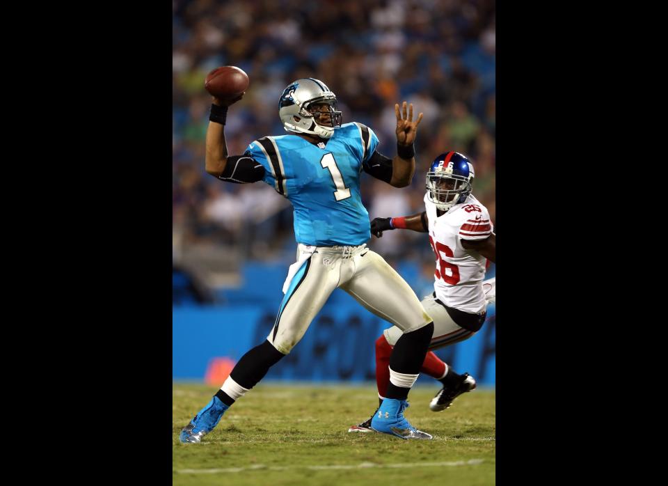 Cam Newton #1 of the Carolina Panthers drops back to pass against the New York Giants during their game at Bank of America Stadium on September 20, 2012 in Charlotte, North Carolina.