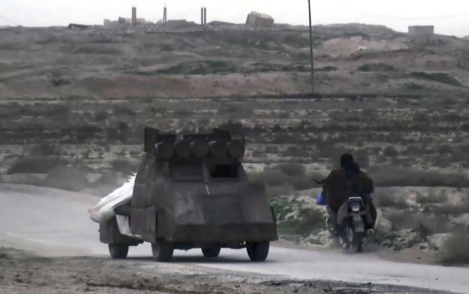 This frame grab from video posted online Friday, Jan. 18, 2019, by supporters of the Islamic State group, purports to show an IS fighter driving a car bomb during clashes with members of the U.S.-backed Syrian Democratic Forces, in the eastern Syrian province of Deir el-Zour, Syria. s they cling to the tiny remains of what was once a self-styled caliphate spanning two countries, IS militants are laying the groundwork for an insurgency. Activists say they are carrying out targeted assassinations, setting up flying checkpoints and distributing fliers to intimidate residents. They fear the group could stage an even bigger comeback if U.S. forces withdraw from Syria. (Militant Photo via AP)