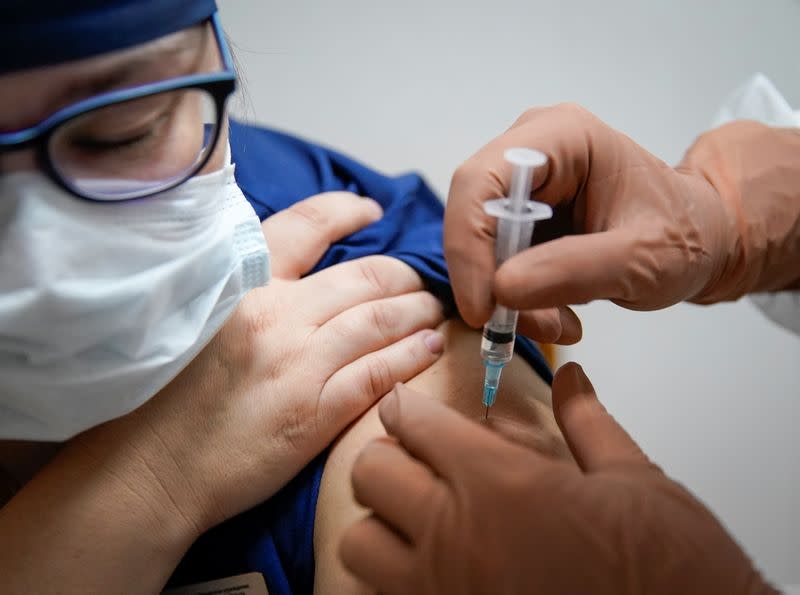 A medic of the regional hospital receives Russia's "Sputnik-V" vaccine shot against the coronavirus disease (COVID-19) in Tver