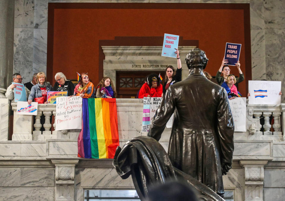 Behind a statue of Abraham Lincoln, demonstrators rally in the Kentucky capitol rotunda to oppose SB 150, a bill that would ban gender-affirming care for trans youth, on March 29, 2023. (Matt Stone / Courier Journal / USA Today Network)