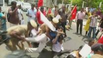 Police try to remove people protesting against the construction of a copper smelter by Vedanta Resources from the road, in Chennai, Tamil Nadu, India in this still image from May 23, 2018 video footage. ANI via REUTERS TV