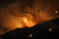 <p>A wildfire burns in the hills near Placenta Canyon Road in Santa Clarita, Calif., July 24, 2016.(AP Photo/Ringo H.W. Chiu)</p>