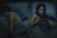 This image released by Amazon shows Aimee Carrero, right, in a scene from "The Consultant." (Amazon via AP)