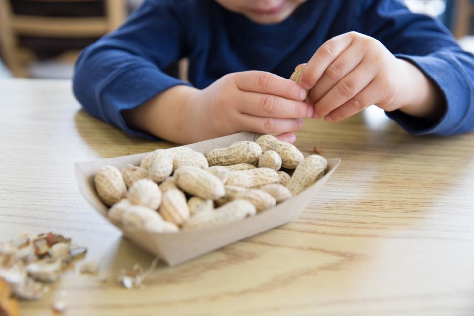 Kid eating peanuts