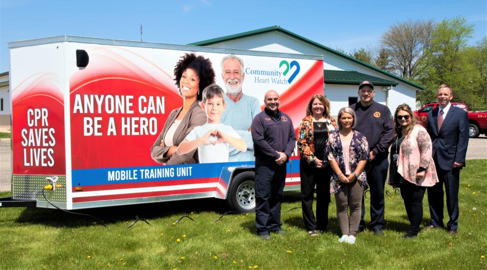 Community Heart Watch members stand in front of the newly unveiled CPR Mobile Training unit: Greenfield Township Fire Department Brad Smith; Teri Watson with Fairfield Medical Center; Deserae Belcher, with FMC; Basil Joint Fire District Assistant Chief Kasey Farmer; Resa Tobin with FMC; and Matt Wideman with Fairfield Federal Savings and Loan.