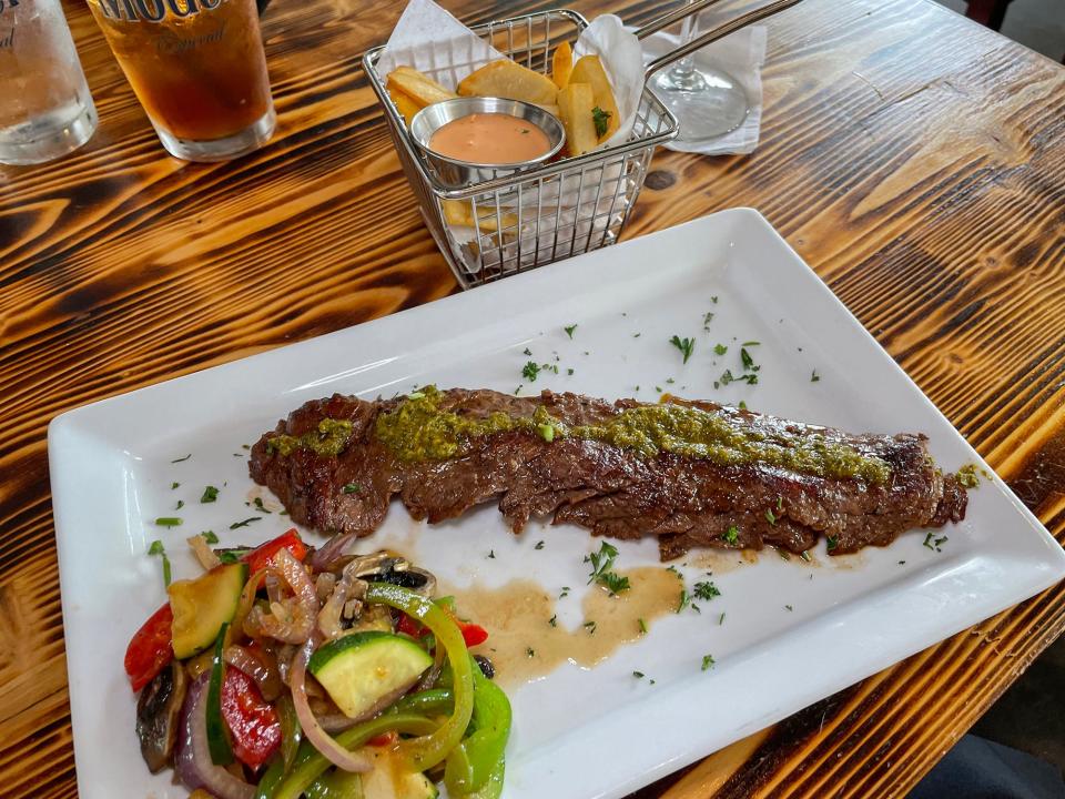 An 8-ounce churrasco steak with grilled vegetables and steak fries at Frank & Sons Steakhouse in Athens, Ga. on Tuesday, Sept. 26, 2023.