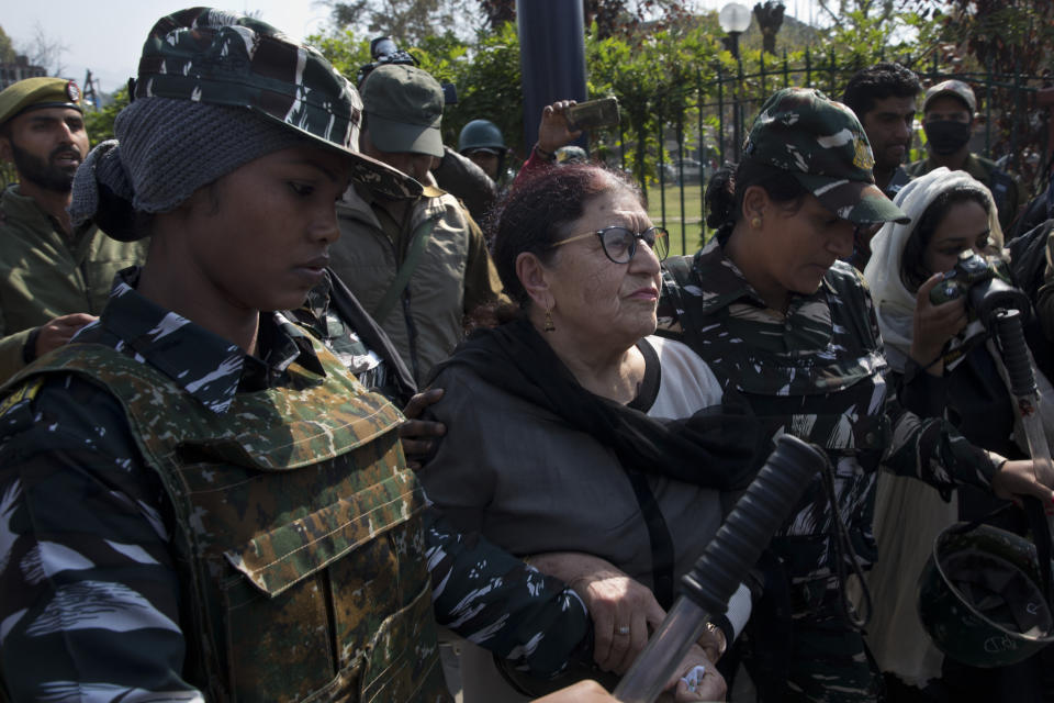 Indian paramilitary women detain a Kashmiri woman who was among those protesting against Indian government downgrading the region's semi-autonomy in Srinagar, Indian controlled Kashmir, Tuesday, Oct. 15, 2019. A small group of women under the banner of ‘Women of Kashmir’, a civil society group had gathered for a peaceful protest demanding restoration of civil liberties and fundamental rights of citizens. (AP Photo/Dar Yasin)