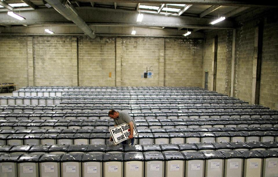 Election Warehouse manager Mick Leonard checks the seals on top of hundreds of ballot boxes in the warehouse of the Dublin County Returning Officer, in Dublin Wednesday May, 30, 2012. before they are distributed to polling stations across Dublin county ahead of the nationwide vote of the Fiscal Stability Referendum Thursday(AP Photo/ Julien Behal/PA) UNITED KINGDOM OUT