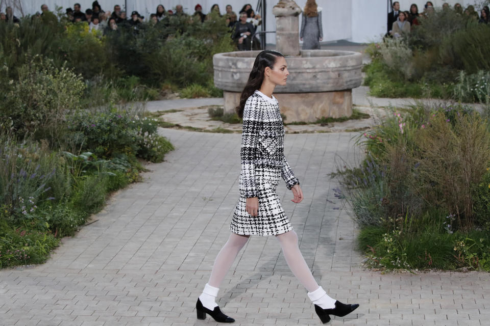 A model wears a creation for the Chanel Haute Couture Spring/Summer 2020 fashion collection presented Tuesday Jan. 21, 2020 in Paris. (AP Photo/Francois Mori)