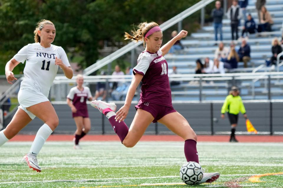 Isabella Winn, of Ridgewood, kicks towards the goal in front of Gianna DeMarco, of Northern Valley, Sunday, October 8, 2023.