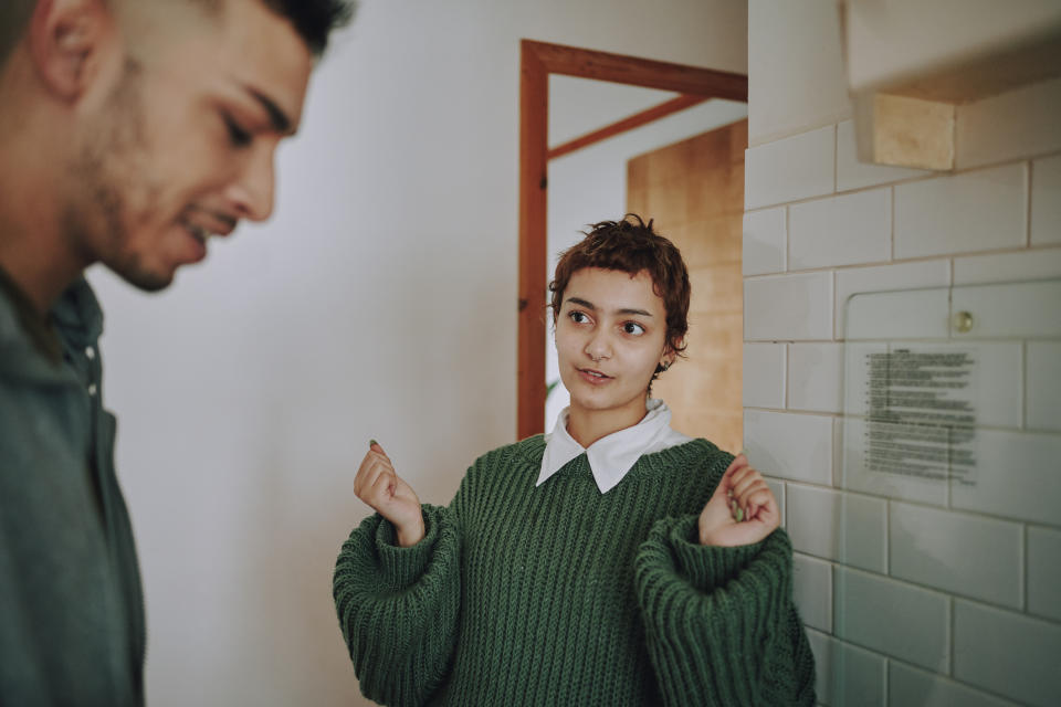 A man and a woman in a bathroom