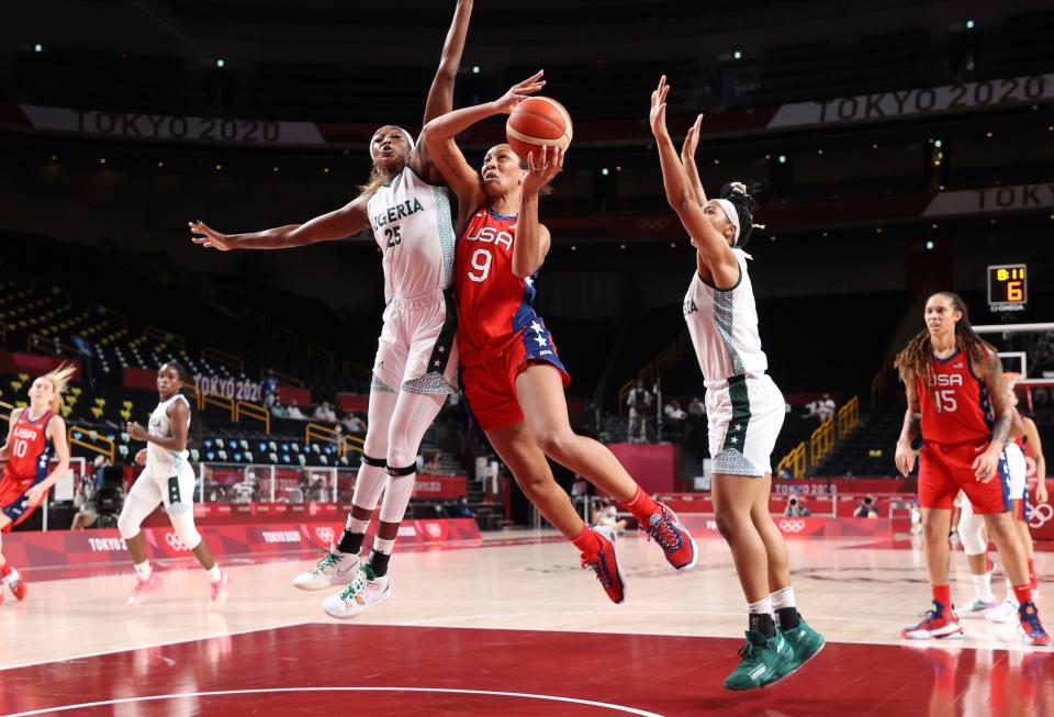 A'ja Wilson rises up towards the basket through pressure from Team Nigeria.