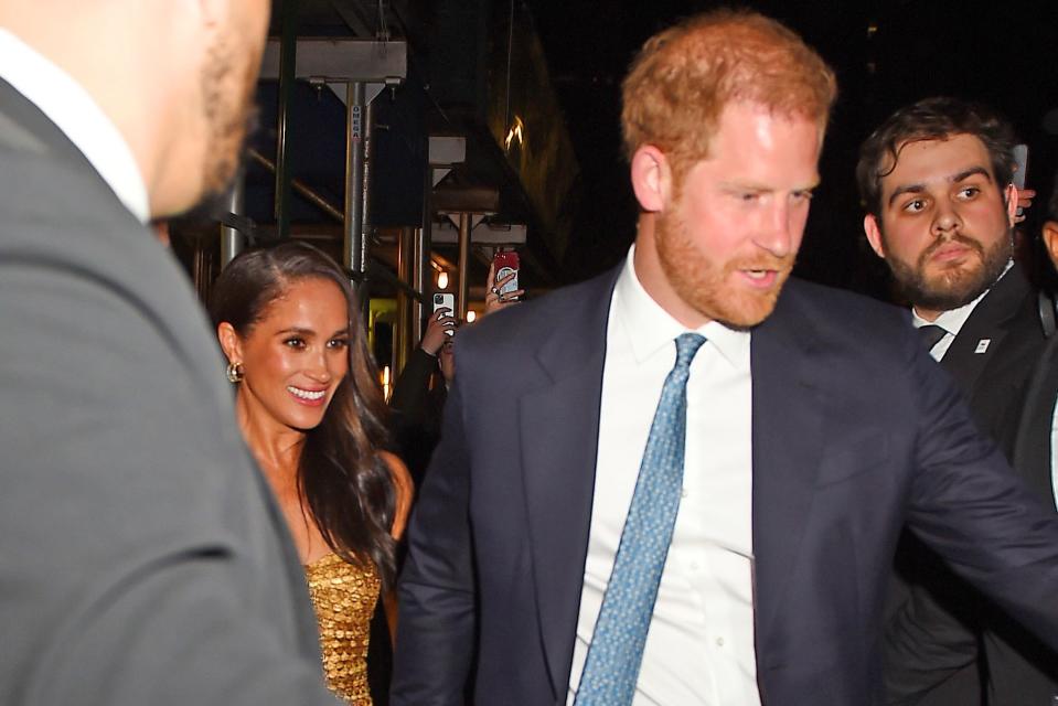 Harry and Meghan Markle leave the awards ceremony last night. Image: MEGA/GC Images