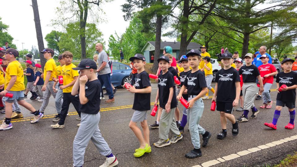 A parade featuring players, coaches and volunteers kicked off Saturday's opening day festivities for Cambridge Little League baseball. First chartered back in 1952, Cambridge Little League baseball will have 330 participants this year.