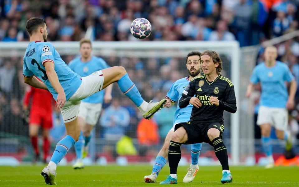 Luka Modric competes for the ball with Ruben Dias - Manchester City vs Real Madrid player ratings: Kyle Walker shuts down Vinicius Junior - AP/Jon Super