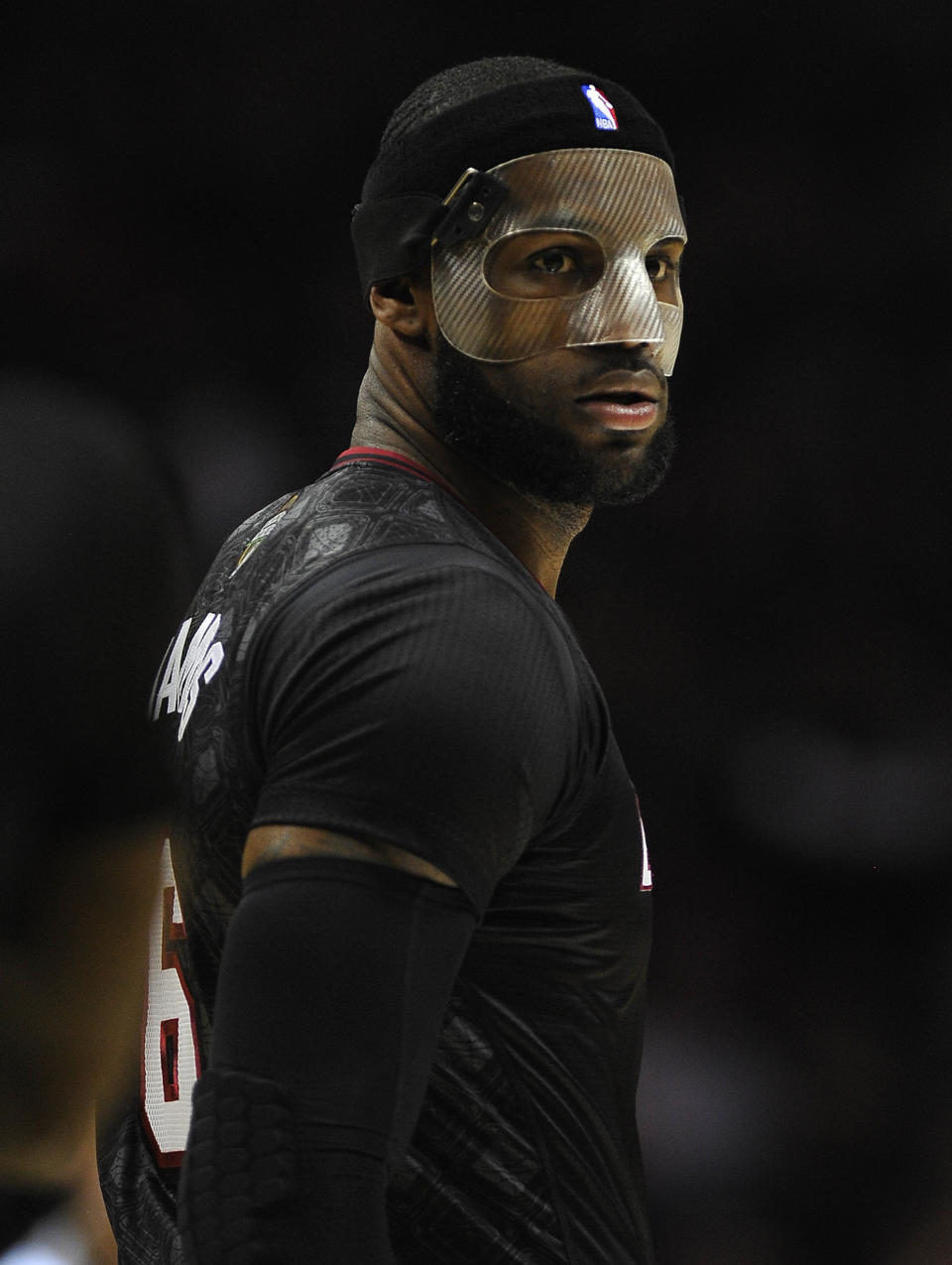 Miami Heat forward LeBron James walks on the court during the first half of an NBA basketball game against the San Antonio Spurs, Thursday, March 6, 2014, in San Antonio. (AP Photo/Darren Abate)
