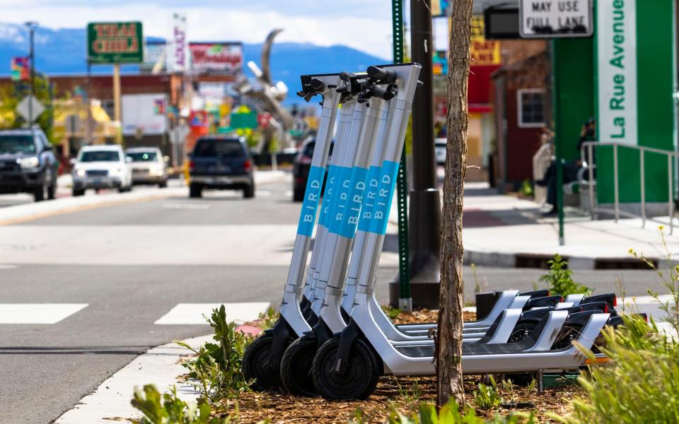 Bird scooters parked by the side of the street in Reno, Nevada
