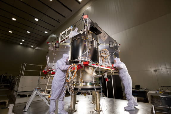 Lockheed Martin technicians in a clean room facility near Denver assembled NASA's OSIRIS-Rex asteroid-sampling spacecraft.