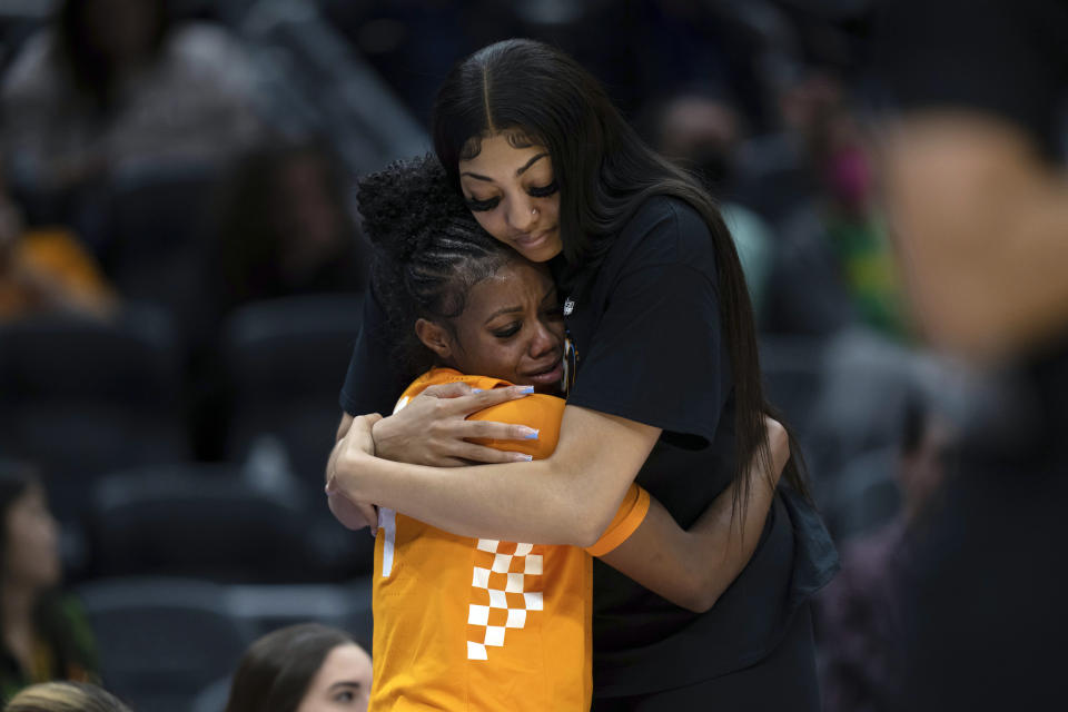 Tennessee guard Jordan Walker, left, gets a hug from center Tamari Key during the second half a Sweet 16 college basketball game of the NCAA Tournament against Virginia Tech, Saturday, March 25, 2023, in Seattle. Virginia Tech won 73-64. (AP Photo/Stephen Brashear)