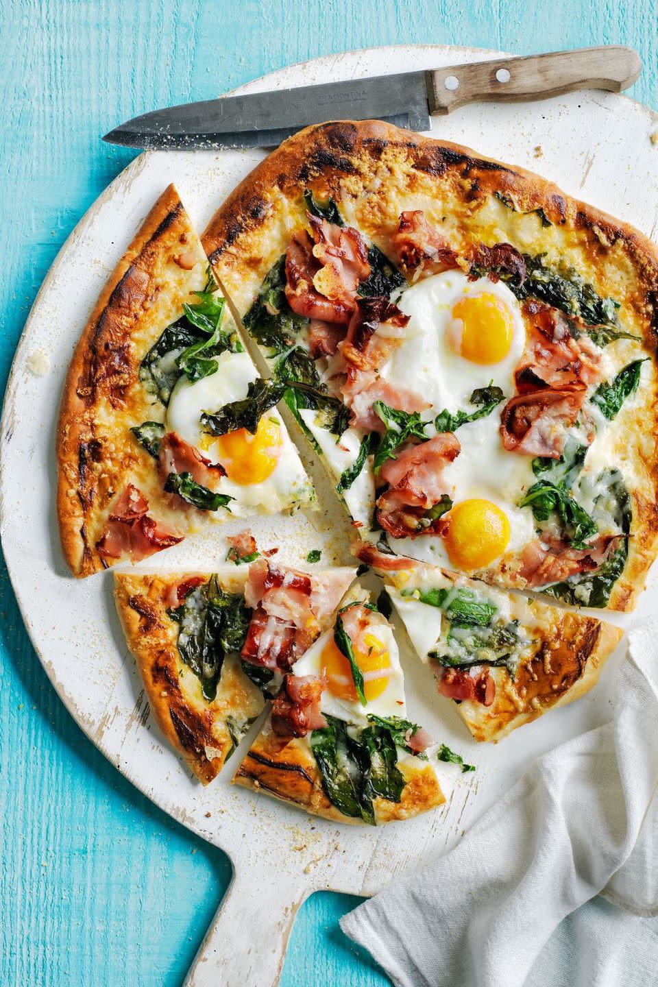 <p>Imagine how excited the kids will be when they find out they're having pizza for brunch! This one is topped with breakfast staples like bacon and eggs. </p><p><a href="https://www.womansday.com/food-recipes/food-drinks/recipes/a54437/sunny-side-up-pizza-recipe/" rel="nofollow noopener" target="_blank" data-ylk="slk:Get the Sunny-Side-Up Pizza recipe.;elm:context_link;itc:0;sec:content-canvas" class="link "><strong><em>Get the Sunny-Side-Up Pizza recipe. </em></strong> </a></p>