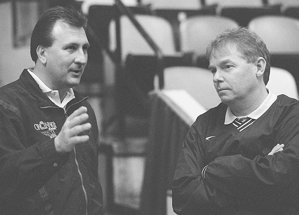 Bob Huggins and Skip Prosser meet prior to an event in 1997.