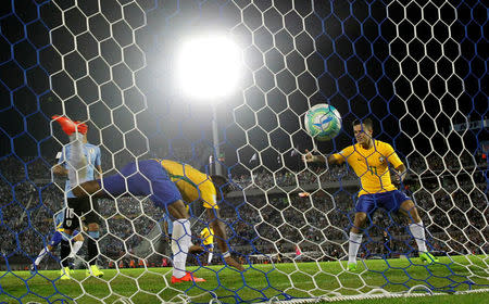 Football Soccer - Uruguay v Brazil - World Cup 2018 Qualifiers - Centenario stadium, Montevideo, Uruguay - 23/3/17 - Brazil's Paulinho (L) celebrates his second goal with teammate Phillipe Coutinho. REUTERS/Andres Stapff