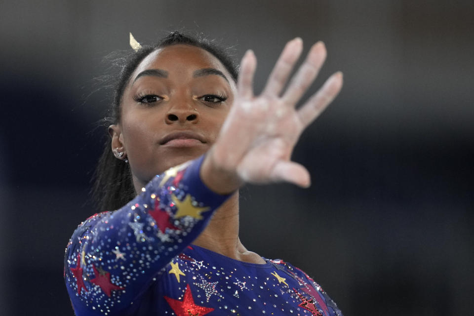 Simone Biles, of the United States, performs her floor exercise routine during the women's artistic gymnastic qualifications at the 2020 Summer Olympics, Sunday, July 25, 2021, in Tokyo. (AP Photo/Natacha Pisarenko)