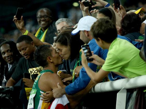 Wayde van Niekerk kisses wife Chesney Campbell after winning Olympic gold in 2016 (Getty)