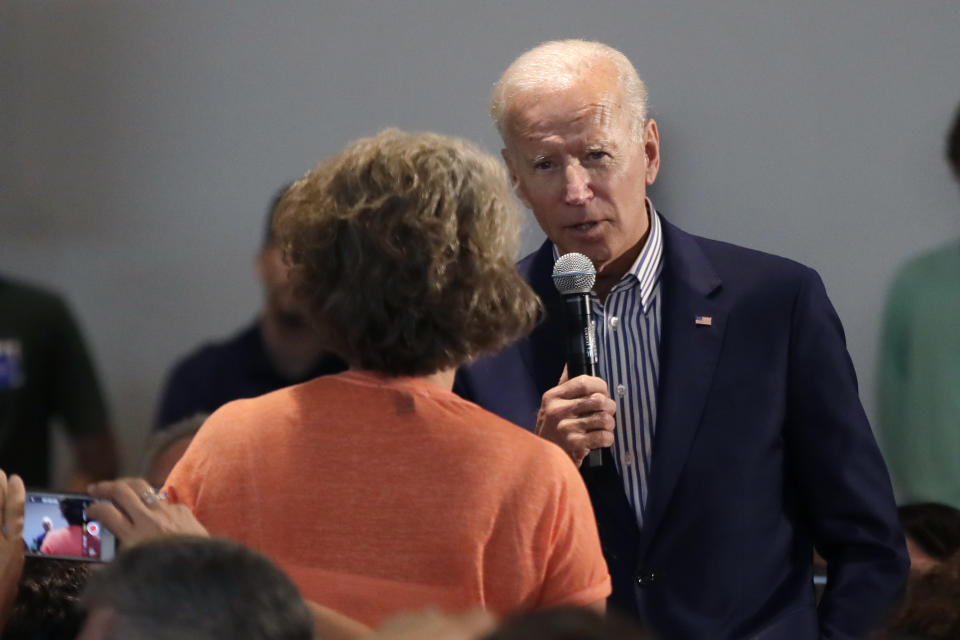Democratic presidential candidate former Vice President Joe Biden answers a question from a woman in the audience during a campaign event at Dartmouth College, Friday, Aug. 23, 2019, in Hanover, N.H. (AP Photo/Elise Amendola)